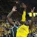 Michigan junior Tim Hardaway Jr. attempts a shot over Michigan State sophomore Branden Dawson during the first half at Crisler Center on Sunday, March 3, 2013. Melanie Maxwell I AnnArbor.com